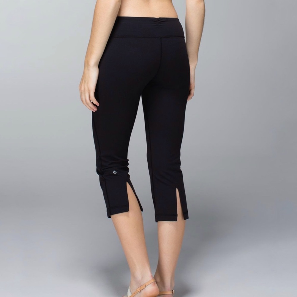 Lululemon all black slit bottom opening behind knees gather & crow crop leggings